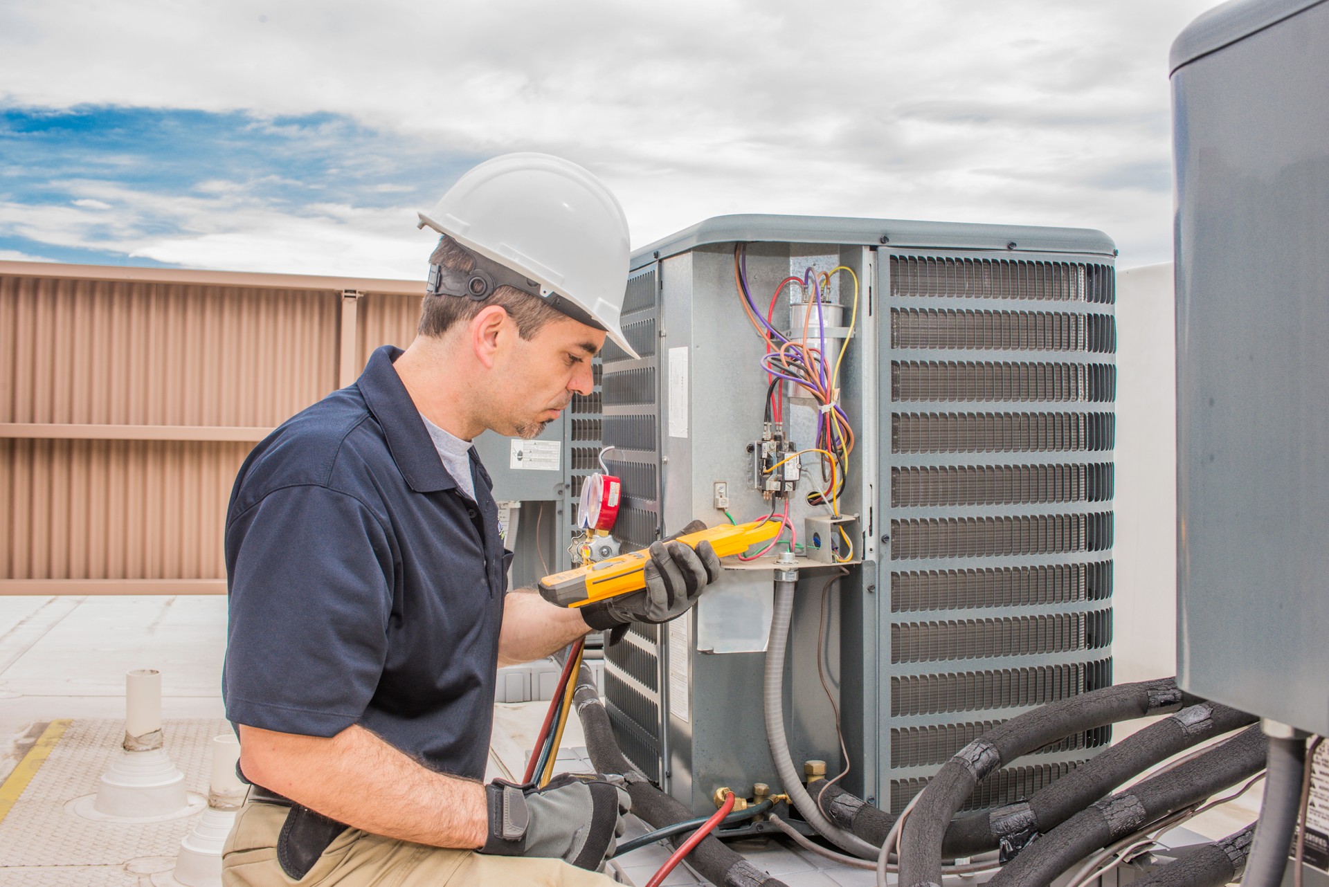 Hvac Tech working on a condensing unit